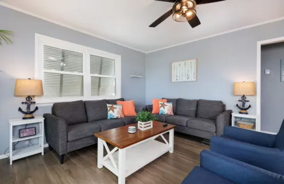 Kick back and get cozy in this breezy living room where the coastal vibes do all the heavy lifting for you.