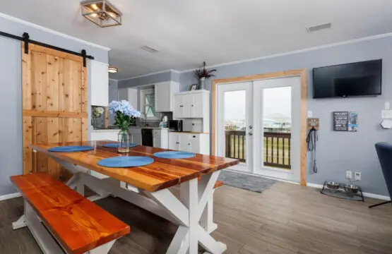 Knock out all your cooking and hangout vibes in this bright, flowing kitchen and dining space where everything's within arm's reach.