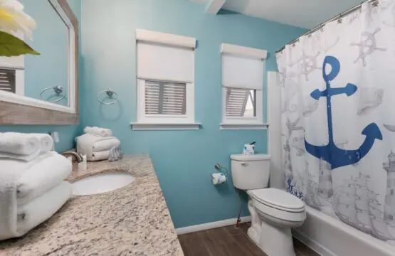 Your morning routine just got way more fun with these turquoise walls giving major beach-house vibes.