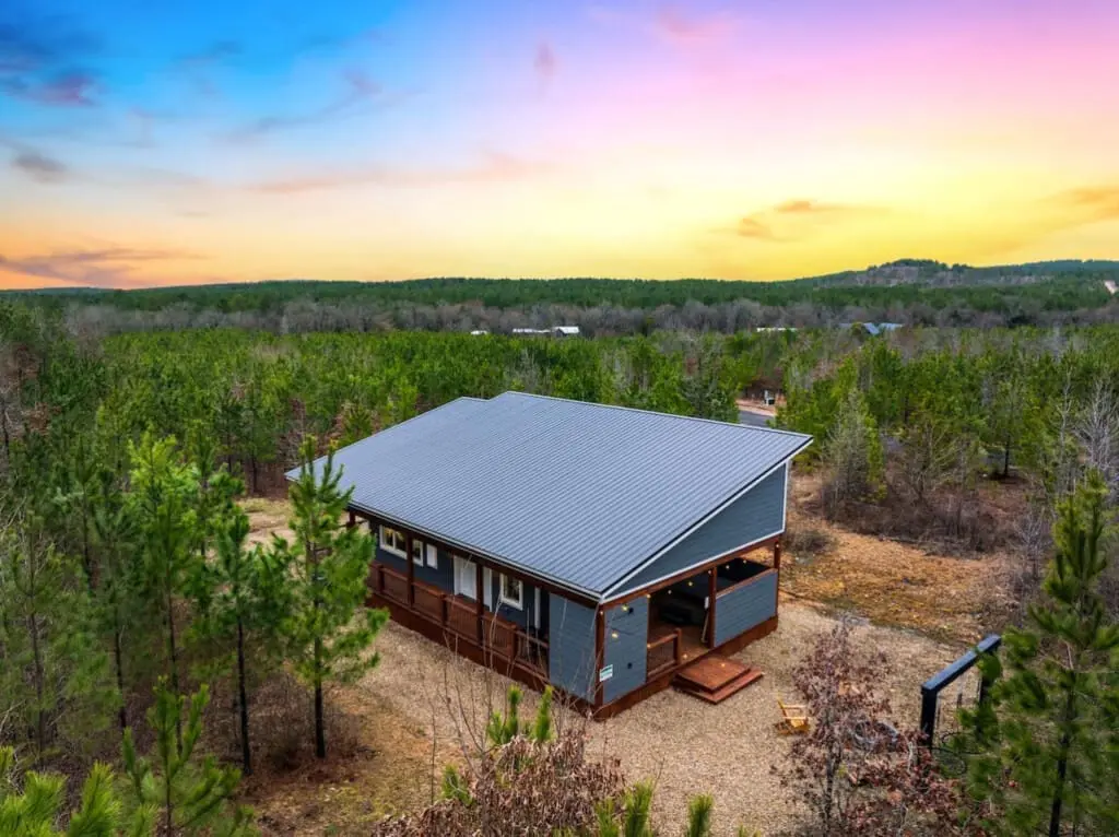 Nestled in a forest so thick and quiet you'd swear you're the only people for miles, this cabin looks exactly like the sanctuary you didn't know you were searching for.