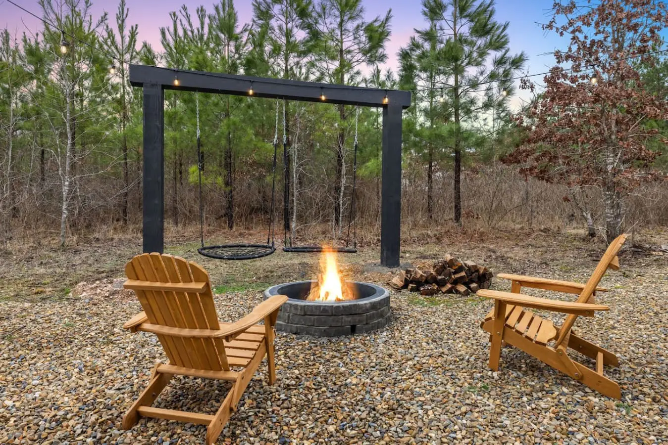 Get those swings moving as the fire pit crackles below and the forest goes quiet around you—this is the kind of simple, perfect evening that stays with you long after you leave.