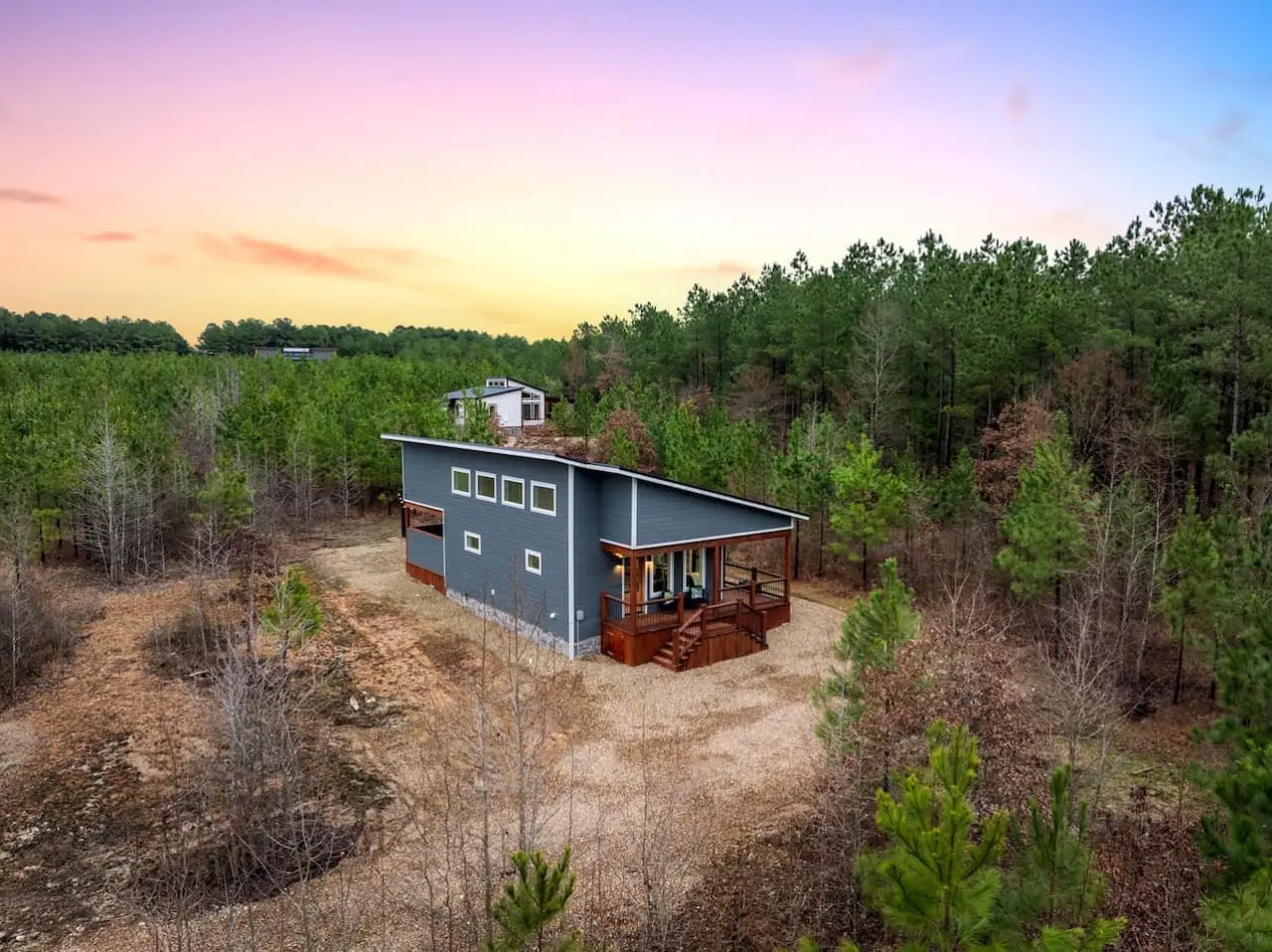 Perched alone in a sea of pines with nothing but forest in every direction, this modern cabin feels like you've finally cracked the code on what a real escape actually looks like.