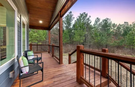 Settle into one of those cozy chairs on the covered porch, let the forest breathe around you, and discover that sometimes the best part of a cabin getaway is just sitting still and listening to the trees.
