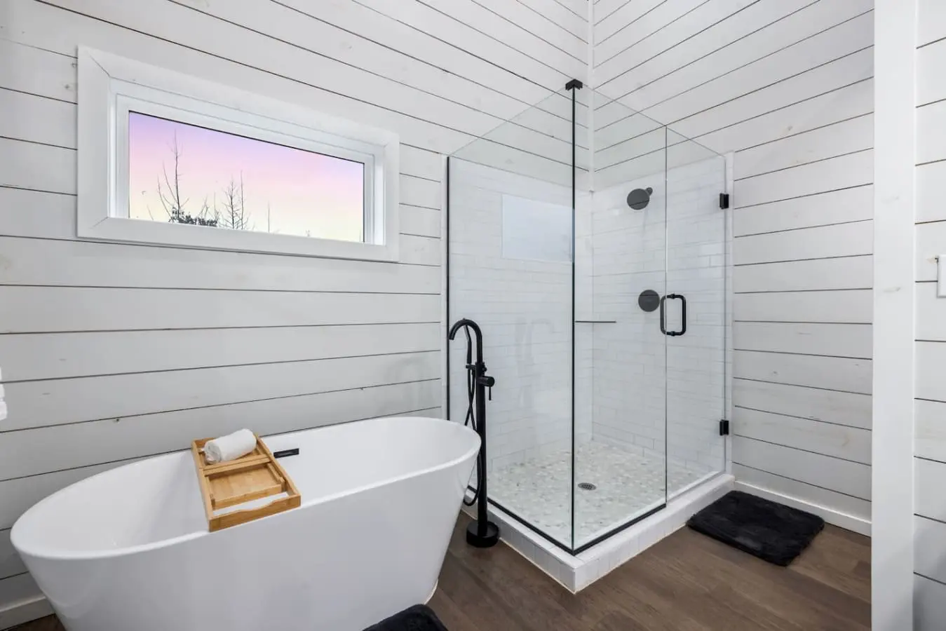 Wake up to that high window view, soak in the freestanding tub with the morning light pouring in, and let the spa shower rinse away any last traces of the real world.