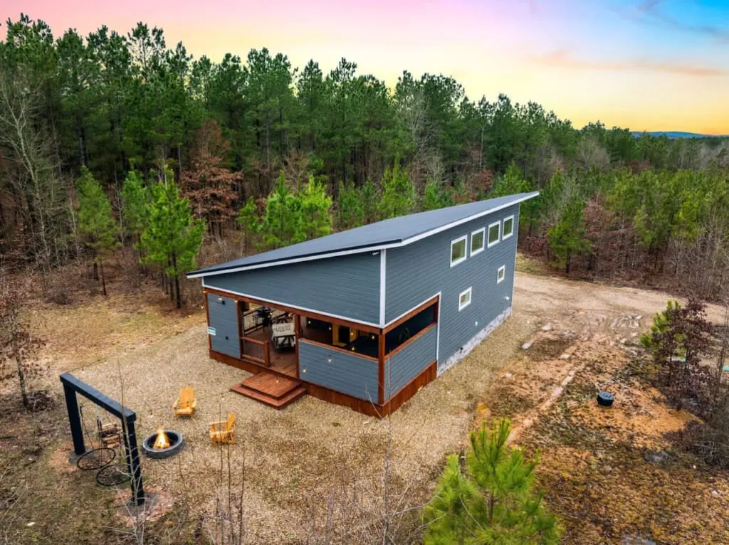 Step outside at dusk and you'll find yourself in that golden-hour sweet spot where the cabin glows against the darkening forest, the fire pit beckons, and you realize this is exactly what "getting away from it all" actually means.