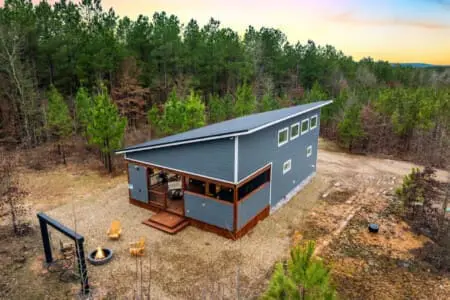 Step outside at dusk and you'll find yourself in that golden-hour sweet spot where the cabin glows against the darkening forest, the fire pit beckons, and you realize this is exactly what "getting away from it all" actually means.