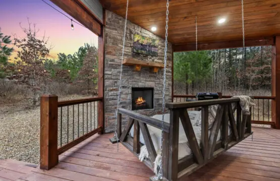 Curl up in one of the hanging beds on your covered porch, watch the stone fireplace glow, and realize this is exactly the kind of peace you've been craving.