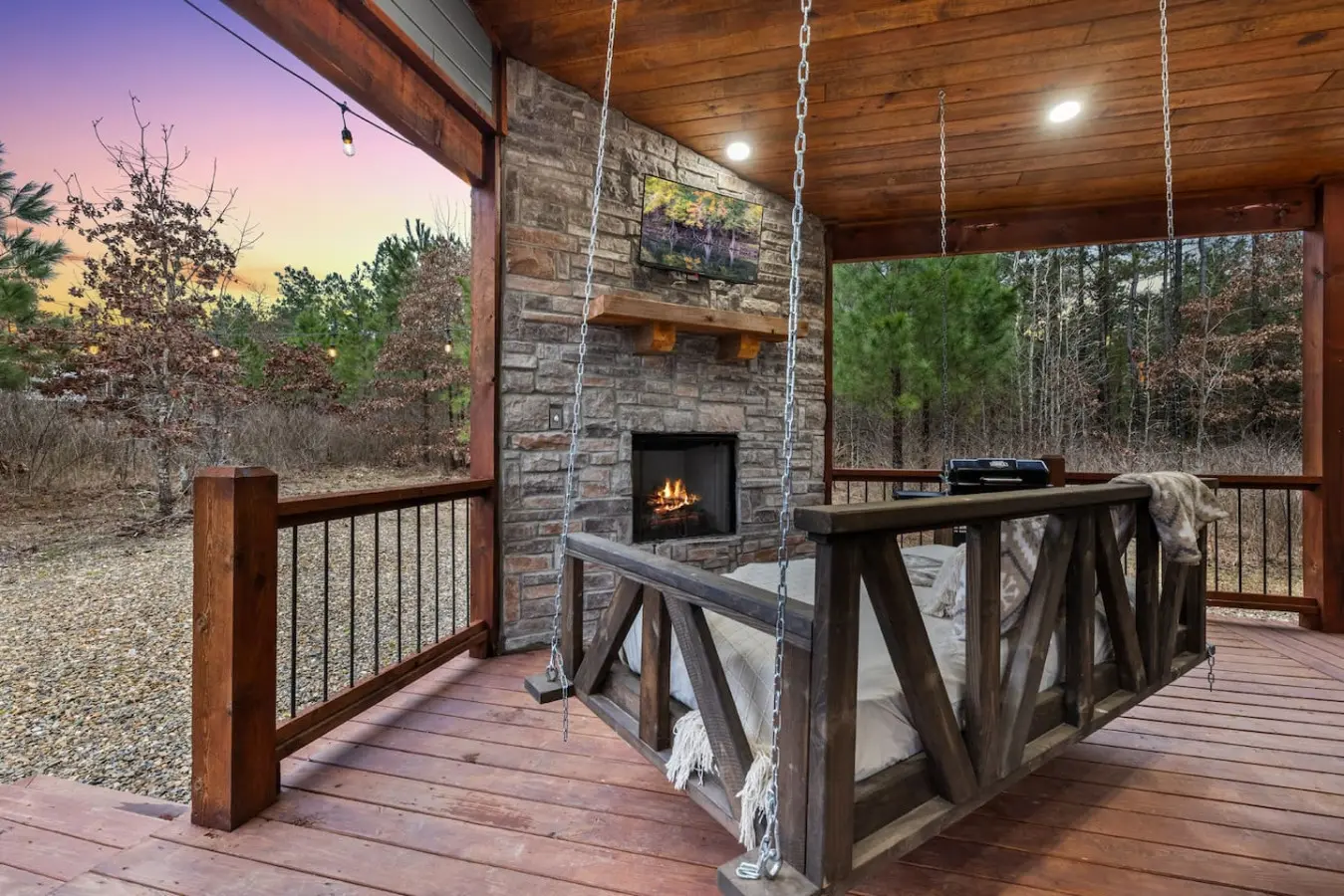 Curl up in one of the hanging beds on your covered porch, watch the stone fireplace glow, and realize this is exactly the kind of peace you've been craving.
