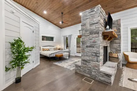 This stone fireplace is basically the centerpiece that ties the whole place together—it's warm, it's gorgeous, and it's the kind of architectural statement that makes you feel like you're staying somewhere genuinely special.