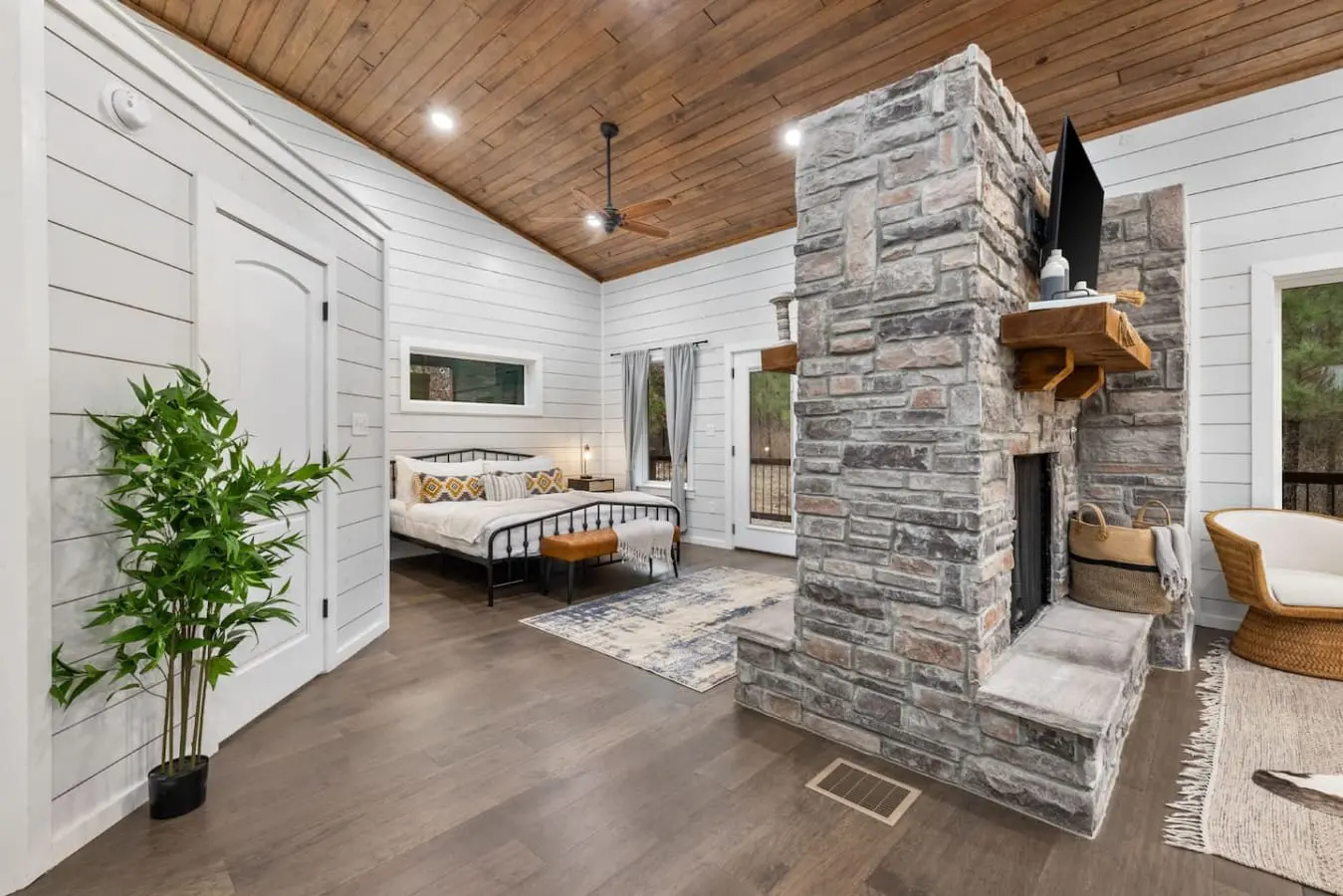 This stone fireplace is basically the centerpiece that ties the whole place together—it's warm, it's gorgeous, and it's the kind of architectural statement that makes you feel like you're staying somewhere genuinely special.