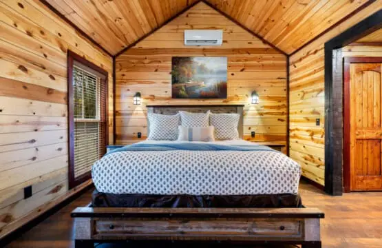 The room is styled as a romantic retreat with modern comforts