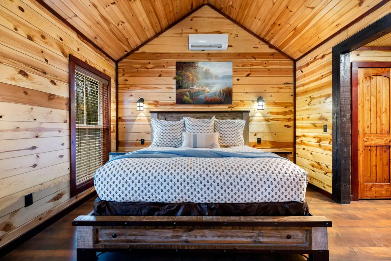The room is styled as a romantic retreat with modern comforts