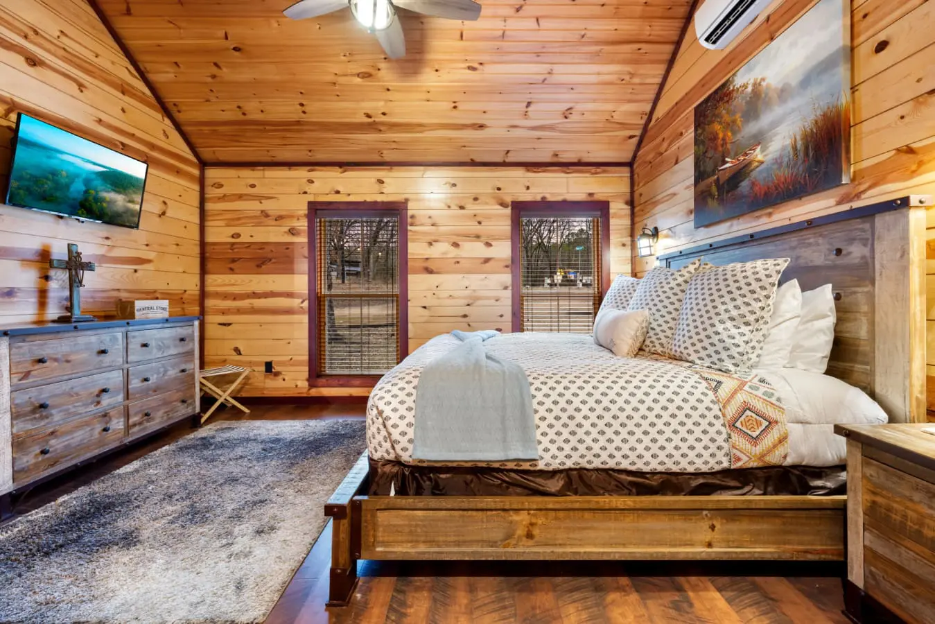 The cabin is designed as a romantic retreat with modern comforts and rustic charm.