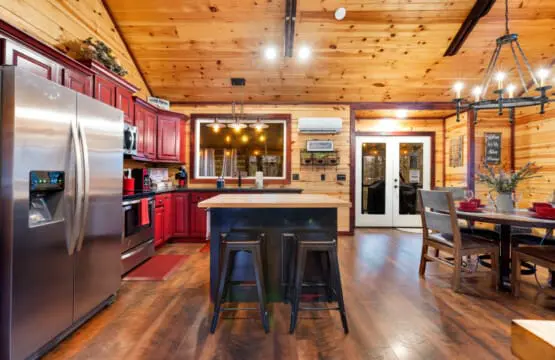 A central wooden island provides additional counter space and bar seating for two