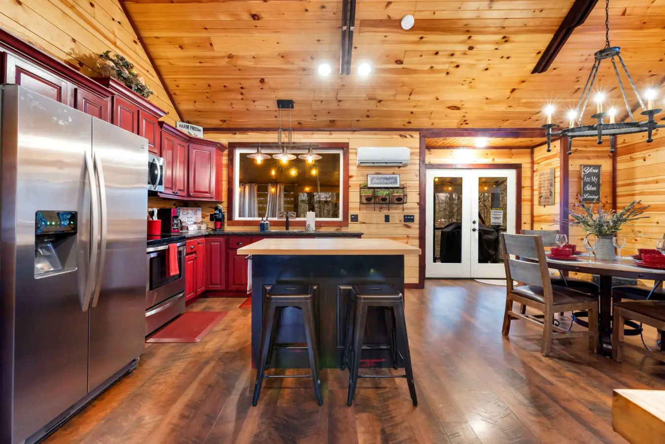 A central wooden island provides additional counter space and bar seating for two