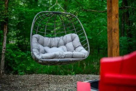 Sink into this hanging pod chair and you'll understand why it's basically impossible to leave once you get comfortable—it's the kind of spot where an hour disappears without you even noticing.