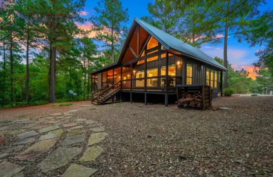 This cabin glowing against the twilight sky surrounded by towering pines is basically the definition of a peaceful escape that actually delivers on all those "getaway" fantasies.