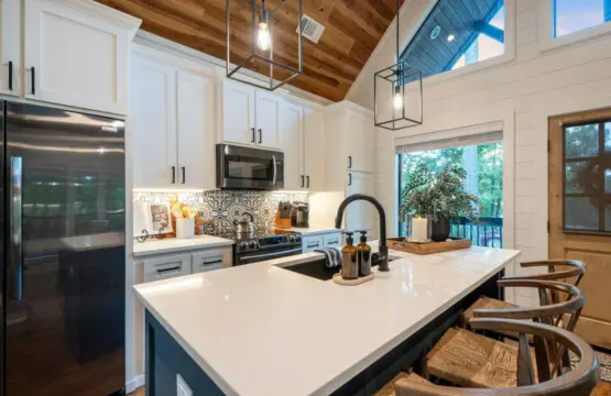 This kitchen is where you'll actually want to spend time cooking with those soaring ceilings, natural light flooding in, and a layout that somehow manages to be both totally functional and seriously gorgeous.