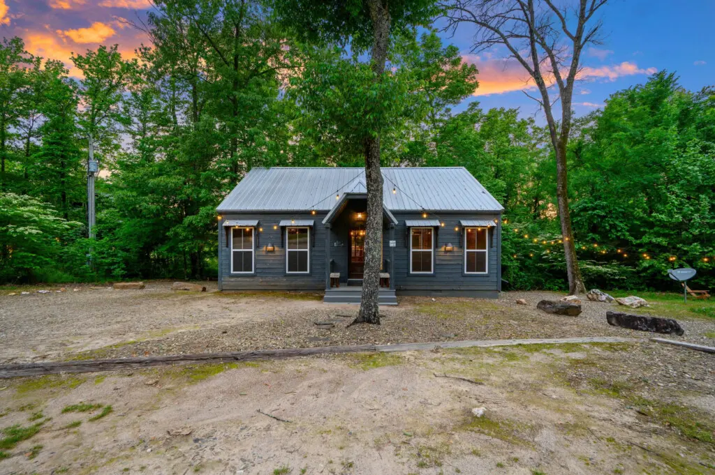 A warm and inviting front view welcoming you to your perfect cabin getaway surrounded by nature