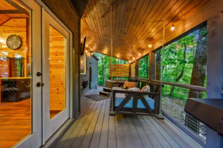 Deck area featuring wide glass doors that open the space to natural light and beautiful outdoor views