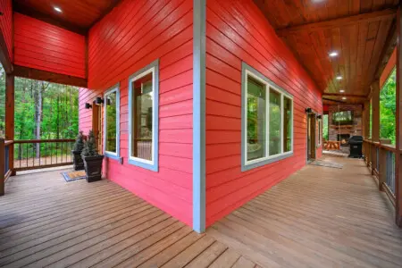 Wrap around this sprawling deck and you've basically got the whole forest as your front porch—perfect for morning coffee, evening hangs, or just soaking in the quiet between those towering trees.