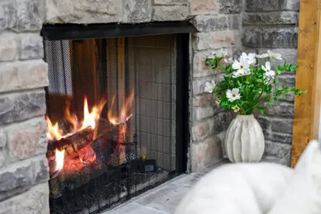 Pull up a seat by the fireplace with fresh flowers on the mantle, and you've got the kind of cozy setup that makes you want to stay put all evening.