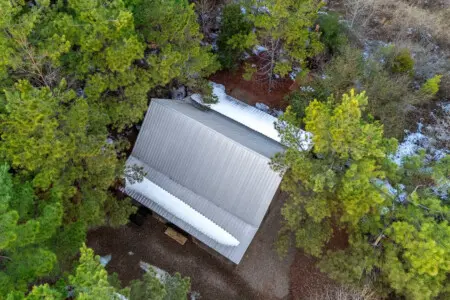 Cozy cabin nestled in the pines with plenty of snow-covered space and that sweet forest solitude you're looking for.
