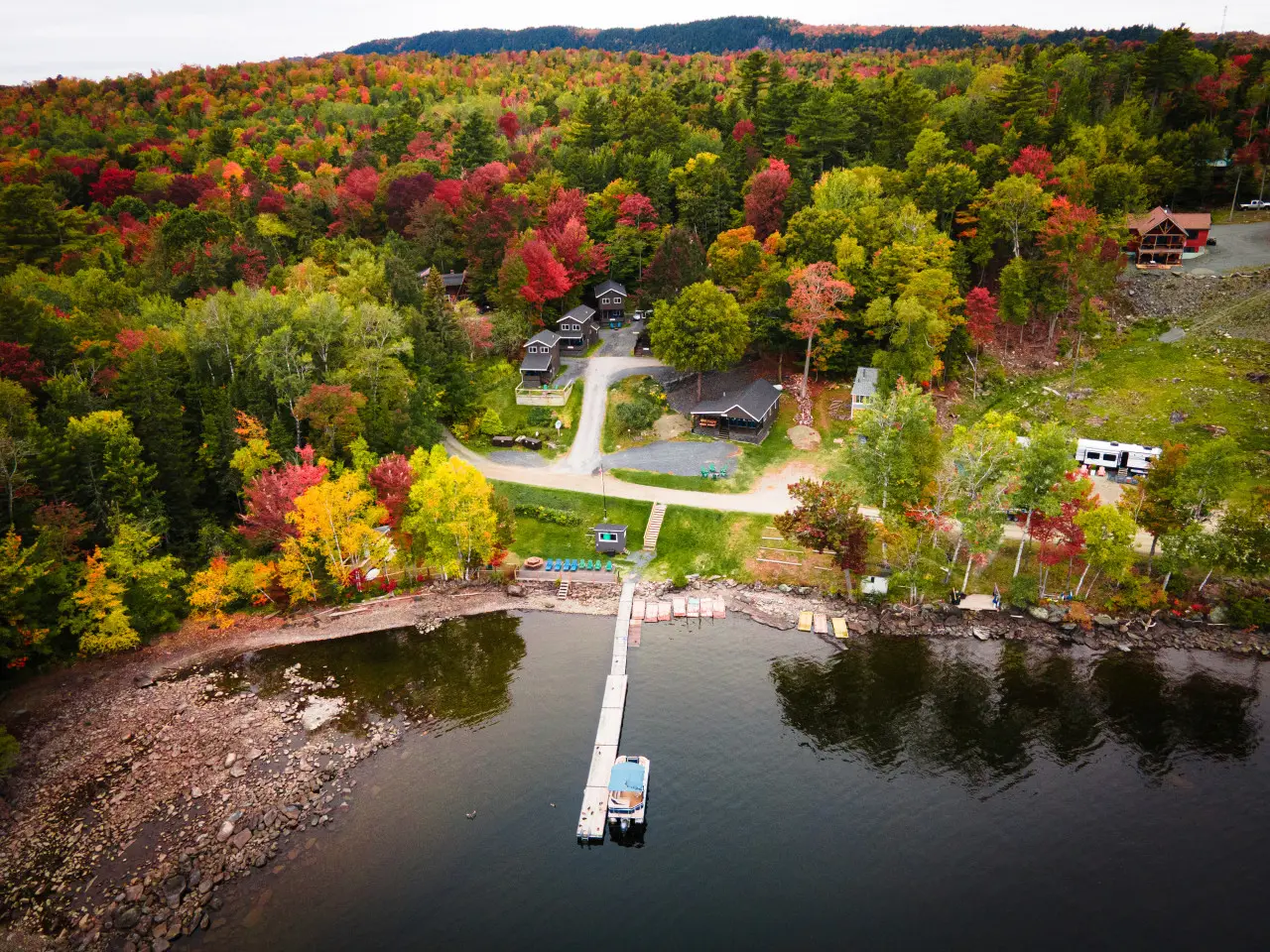 Surrounded by fire-colored trees, the cabin rests in golden stillness.
