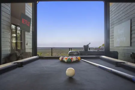 Pool table with a view—rack 'em up and break while the sun sets over Broken Bow.