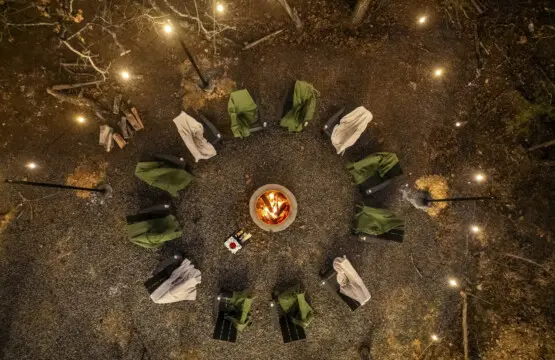 Gather the whole crew around the fire pit after dark — blankets, stars, and good company.