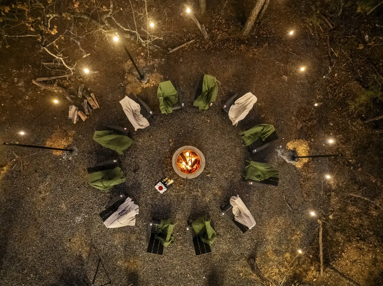 Gather the whole crew around the fire pit after dark — blankets, stars, and good company.