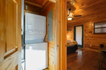 This cozy log cabin features its own washer/dryer combo for convenient laundry during your stay.