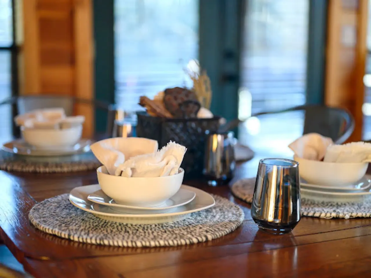 Stunning oceanfront dining room with floor-to-ceiling windows and refined coastal ambiance.