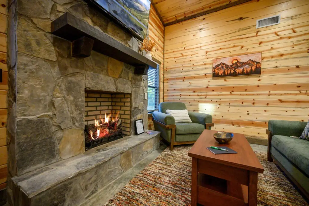 This stone fireplace is basically begging you to sink into one of those green chairs and just zone out for a while.