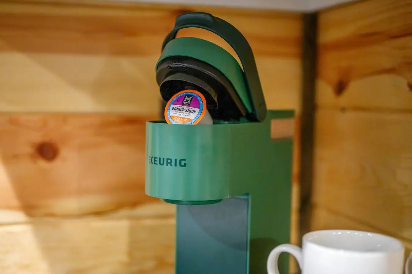 This cute little Keurig setup tucked into the cabin's nook proves that even the coziest getaways need their coffee fix.