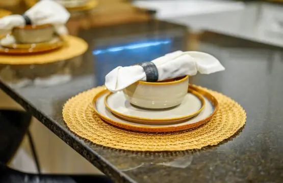 The elegant table settings with those crisp white linens and gold accents definitely set the mood for some seriously memorable dinners at this place.