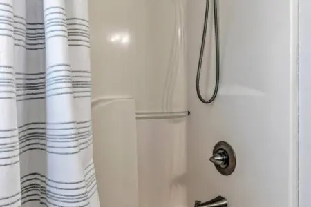 This clean, updated bathroom with its sleek fixtures and walk-in shower is ready to rinse off the salt and sand so you can get back out there and do it all over again.