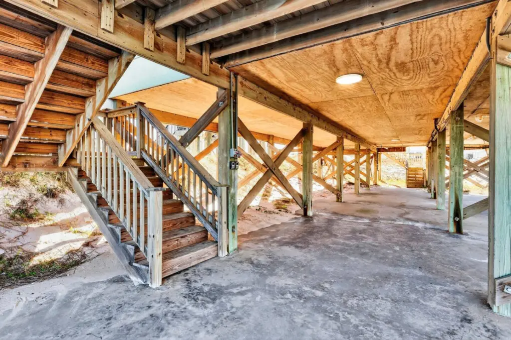 This sun-soaked covered walkway is basically your personal gateway to the beach—where sandy floors, soaring ceilings, and direct access to the shore create the perfect blend of indoor comfort and outdoor adventure.
