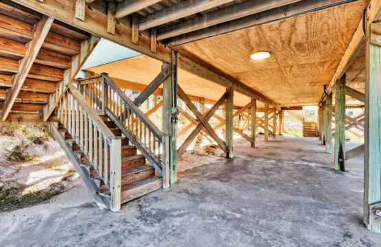 This sun-soaked covered walkway is basically your personal gateway to the beach—where sandy floors, soaring ceilings, and direct access to the shore create the perfect blend of indoor comfort and outdoor adventure.
