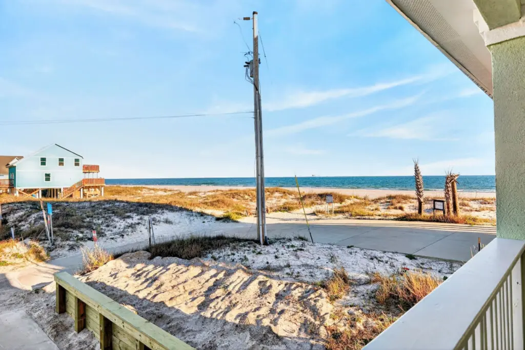 Step out onto your private deck, breathe in that salty air, and realize you've found exactly the kind of beachfront home where you can watch the ocean shift from blue to gold without ever leaving your favorite chair.