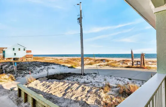 Step out onto your private deck, breathe in that salty air, and realize you've found exactly the kind of beachfront home where you can watch the ocean shift from blue to gold without ever leaving your favorite chair.