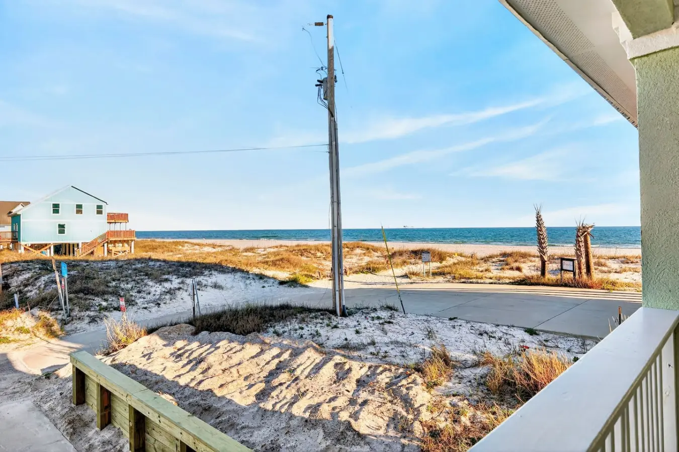 Step out onto your private deck, breathe in that salty air, and realize you've found exactly the kind of beachfront home where you can watch the ocean shift from blue to gold without ever leaving your favorite chair.