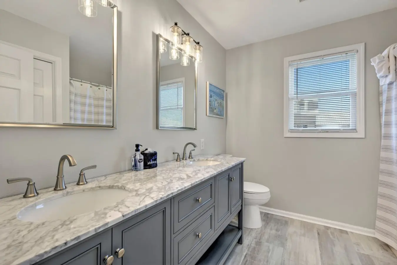 This spa-like master bathroom is where you'll start and end every day in style—featuring dual vanities, gleaming marble countertops, and that perfect blend of luxury finishes that make even your morning routine feel like a mini vacation.