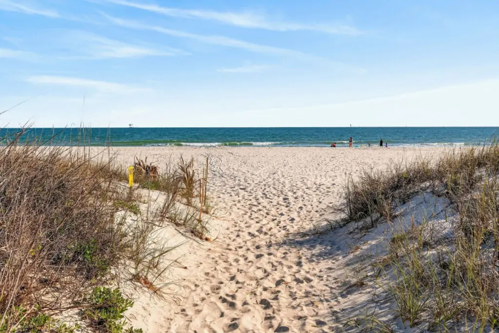Step right over the dunes and onto the sand—this is the kind of beachfront spot where you're literally seconds away from the waves and everything that makes a coastal getaway feel like home.