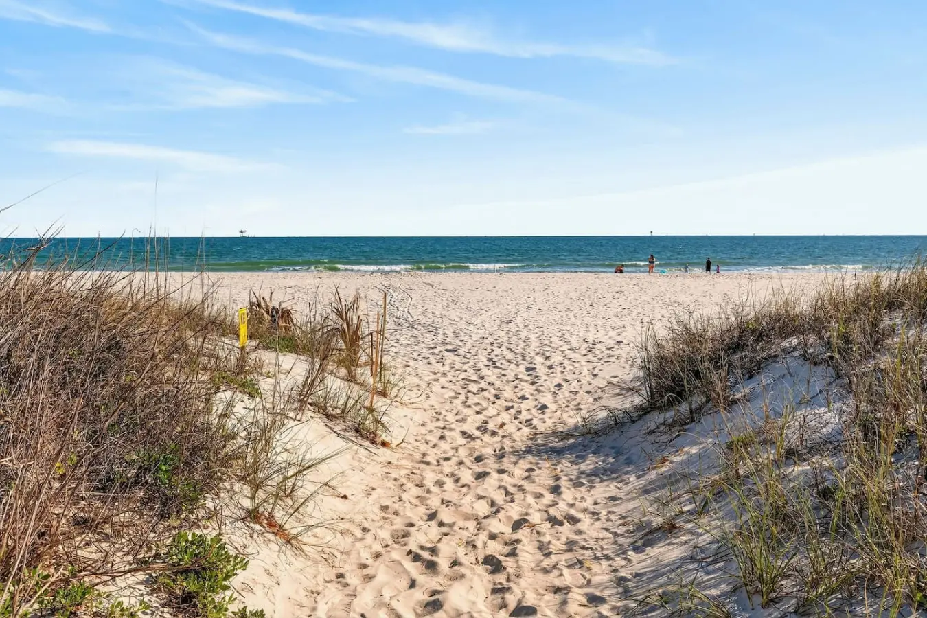 Step right over the dunes and onto the sand—this is the kind of beachfront spot where you're literally seconds away from the waves and everything that makes a coastal getaway feel like home.