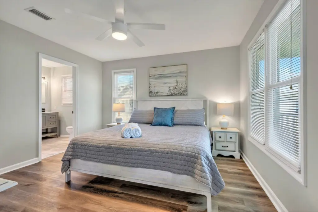 This serene master bedroom is the perfect retreat after a day in the sun—complete with soft coastal vibes, plenty of natural light, and that peaceful quiet where you can actually hear the waves at night.