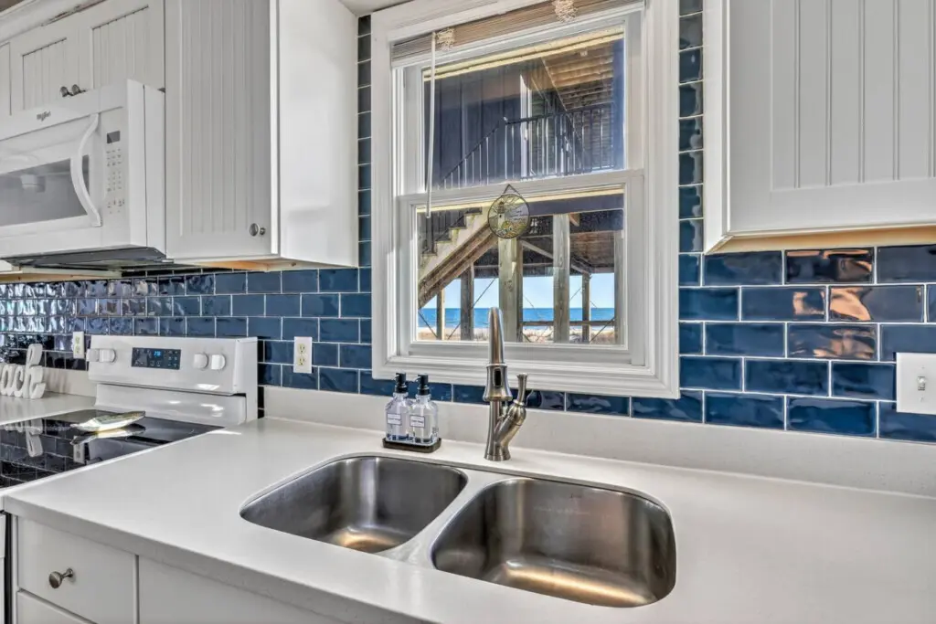 Cook up your favorite meals in this bright, updated kitchen, then gaze out at the ocean views while you wash the dishes—basically the best reward after a day in the sand.