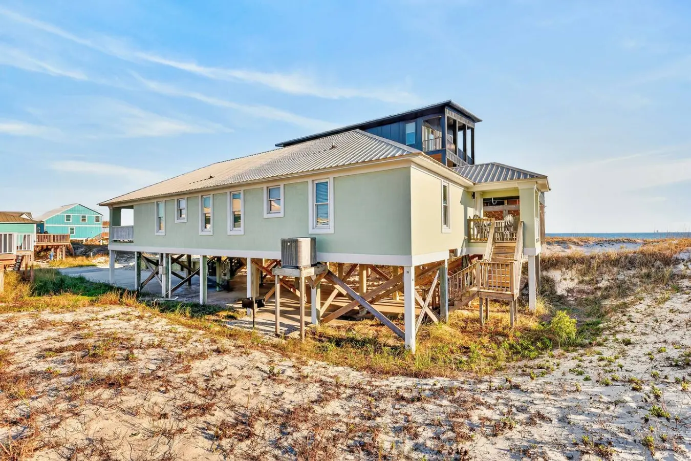 This light-filled beachfront home sits perfectly on the sand with wraparound decks ideal for soaking in the sea breeze and endless ocean views all day long.