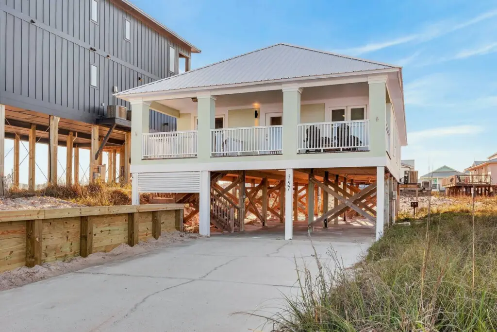 This elevated coastal gem offers everything you need for the ultimate beach escape—direct sand access, multiple decks for catching the breeze, and that laid-back beachfront living you've been craving.