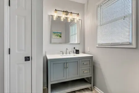 This bright, beautifully appointed bathroom with its soft lighting and spa-like finishes is the perfect place to rinse off the salt and sand before heading back out for round two.